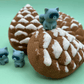 Snow Dusted Pine Cone Bath Bomb for Kids with Raccoon Figure Inside