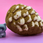 Snow Dusted Pine Cone Bath Bomb for Kids with Raccoon Figure Inside