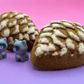 Snow Dusted Pine Cone Bath Bomb for Kids with Raccoon Figure Inside