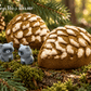 Snow Dusted Pine Cone Bath Bomb for Kids with Raccoon Figure Inside